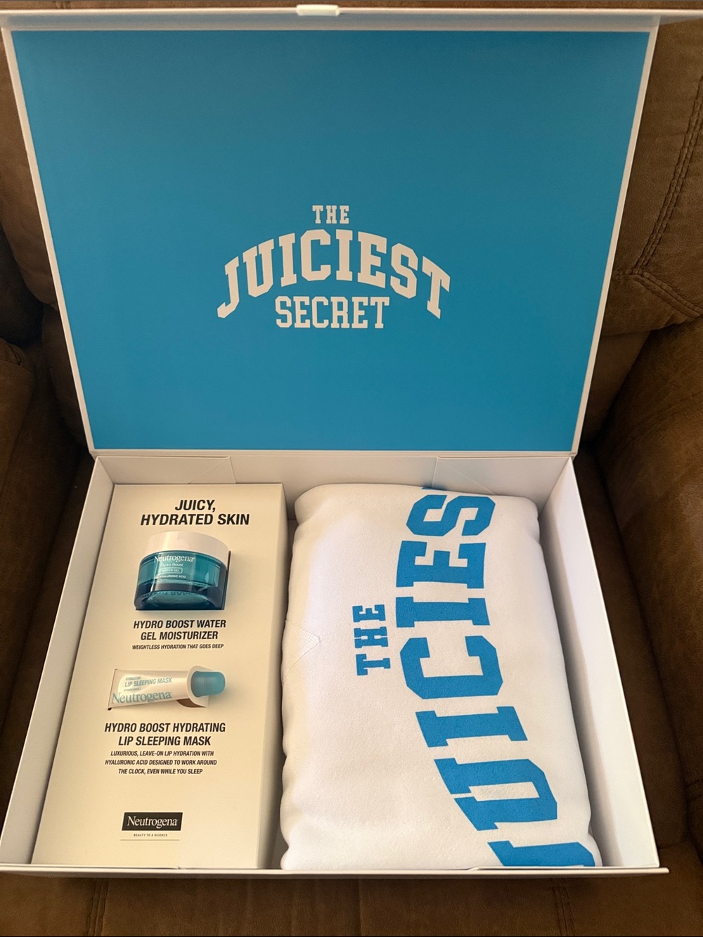 Neutrogena White Tee with Blue 'The Juiciest Secret' Print